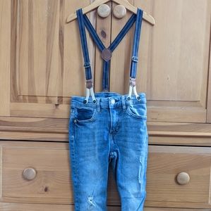 Boys suspender jeans, skinny and slightly distressed.